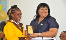 Student of the Year Conyana Yarde receives award from Chief Education Officer Ms Fontaine