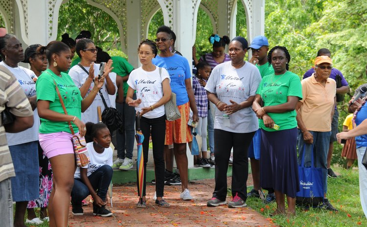 Participants gather at the Botanic Gardens after the solidarity walk against child abuse