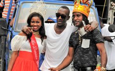 Bobb,right, Miss Dominica 2017 and fan at Carnival 2018 parade