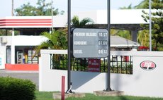 Billboard of gas, kerosene and diesel prices on display outside the NP gas station at Canefield