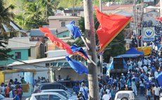 UWP blue flags and DLP red flags one post near the main road in St. Joseph