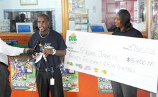 DNL officials present cheque to Joseph (absent)