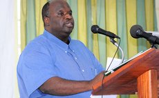 Electoral Commission Chairrman Gerald Burton addresses DAIC function