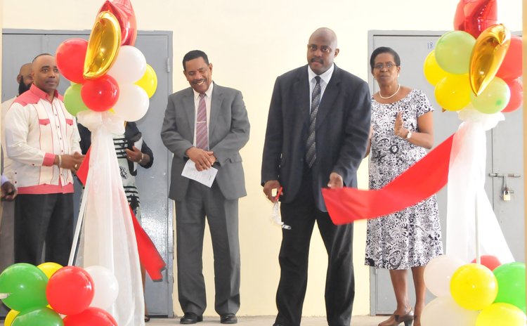 Government officials cut ribbon to open the Portsmouth pack house