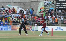 Narine bowls against New Zealand at the Windsor Park Sports Stadium in Roseau