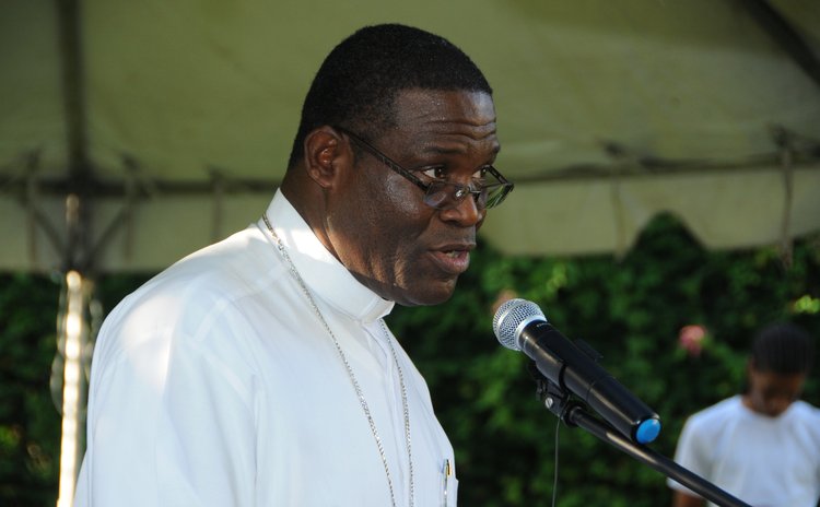 Bishop Malzaire speaks at the Dominica Climate Change Day of Action at the Botanic Gardens, Roseau on Saturday November 28, 2015