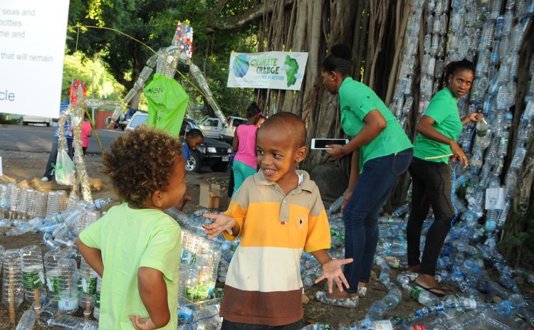 Children and plastic bottles at the Dominica Climate Change Day of Action at the Botanic Gardens, Roseau on Saturday November 28, 2015 