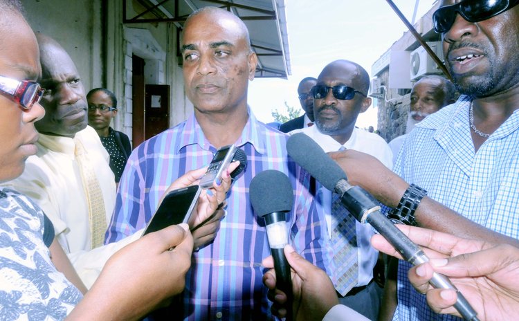 FILE PHOTO: Lugay speaks to the press just after he was charged last July
