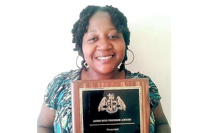 Dawn Francis shows off her award
