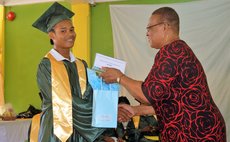 Denise James hands prize to top student