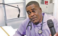 Dr Phillip St.Jean speaks to the press