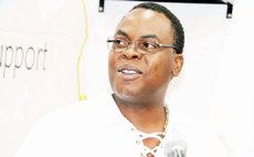 Dr. Christmas speaks to the Dominica Society AGM