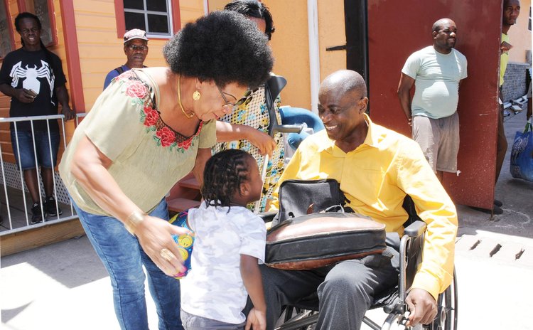 Dr Sam Christian greets his daughter on his arrival from medical treatment in  Martinique