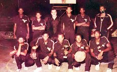 John Keller Eagles II with trophies, pose with their coach (standing, far Right) and sponsor (standing, 2nd from Left). Photo courtesy: Leroy Dover