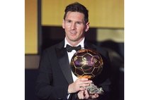    Argentine football star Lionel Messi poses with trophy after winning 2015 FIFA Ballon d'Or for the best player at the annual FIFA Ballon d'Or gala in Zurich, Switzerland, on Jan. 11, 2016. 
