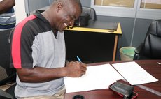 A farmer signs the contract