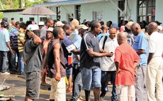 Farmers wait at Division of Agriculture for World Bank grants