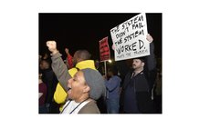 WASHINGTON D.C., Nov. 25, 2014 (Xinhua) -- People protest against the grand jury's decision not to charge police officer Darren Wilson in the fatal shooting of African American youth Michael Brown 