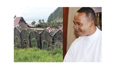 Fr. Branker John and the damaged Grand Bay Catholic Church