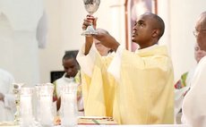 Fr Calvin Auguiste at the alter