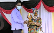 At the 2020 Golden Drum awards ceremony, Joan Frampton receives award from PS Blackmore