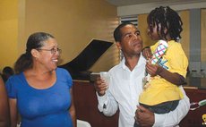 Joshua Francis hold child (photo from his Facebook page)