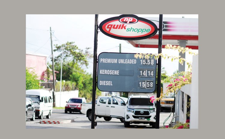 Sign at Canefield station showing new gas prices 