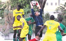 Grenadian goolkeeper makes save in the first match of the Windward Islands football tournament at the Windsor Park Sports Stadium on Wednesday May 30, 2014