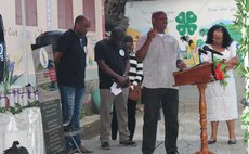 Praying at the Pointe Michel ceremony