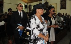Judith Pestaina, front row, at the funeral of her husband