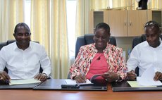 Flow General Manager Jeffrey Baptiste, Director of Dominica Social Security Janice Jean-Jacques Thomas & DSC Chairman of the Dominica Social Security signing official documents 