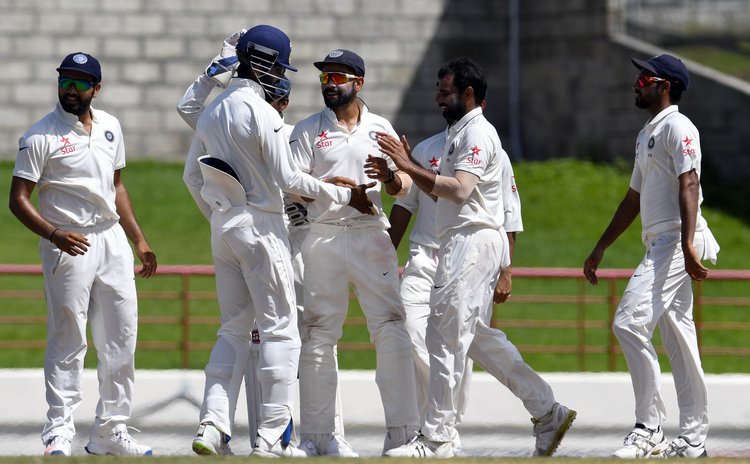 India's team celebrate after beating West Indies in the third Test in St Lucia