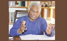 Israel Khan at his office ( Photo courtesy Trinidad Guardian)