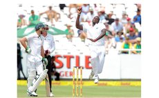 Jason Holder bowls against South Africa