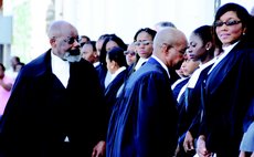 Judge Errol Thomas, left, and law officials at the opening of the New Law Year