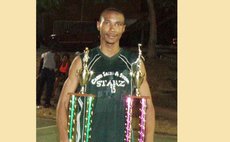 Kelsey Guye with MVP and Slam-Dunk trophies, 2013 basketball season opener