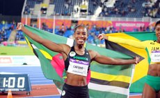 Draped in the Dominican Flag at the Commonwealth Games- Thia LaFond