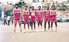 Ambassadors in uniforms made by player Russell Moreau (L); 1980