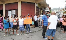 Supporters of the UWP gather outside law office to pay fine