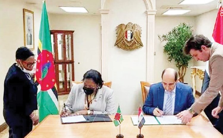The picture that created trouble for the Dominica UN ambassador- Bannis Roberts signs diplomatic relations agreement with Syria