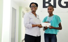 Mrs Doctrove presents scholarship award to Jarnila Phillip