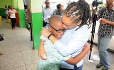 Bertilia McKenzie hugs her son