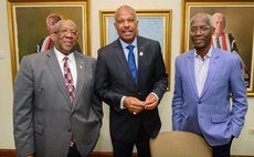 Professor Beckles, centre, at press conference to announce new Five Islands campus