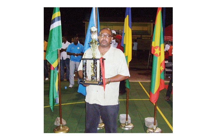 Coach Mickey Joseph with Dominica's 3rd place trophy, Windward Islands Basketball Championships, Grenada, 2010