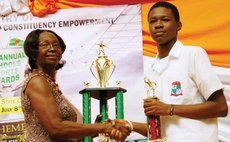 Ms. Walsh hands over trophy for table tennis to PSS