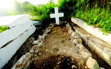 Covered grave at the Roseau Catholic Cemetary