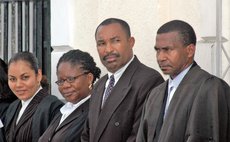 Michael Bruney. right, and other lawyers at an opening of a High Court Session