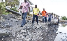 PM Skerrit, front and Hector John, second in row, visit Coulibistrie after the storm 