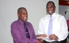 NCCU manager Aylmer Irish receives gift from LIME CEO Baptiste