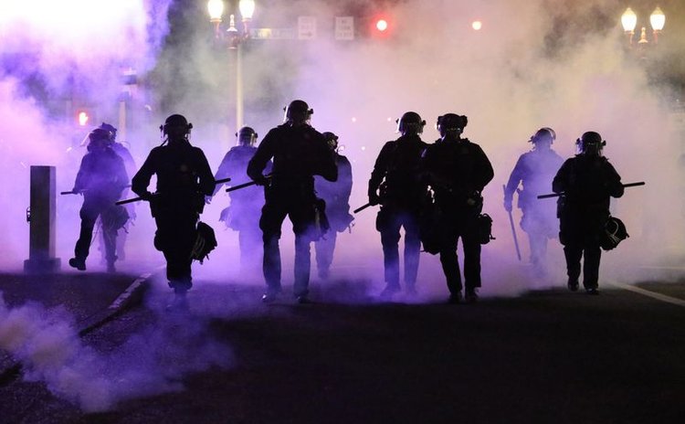 Police use tear gas to control demonstrators in George Floyd  death protest